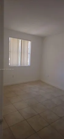 a white toilet and tub sitting next to a bathroom sink