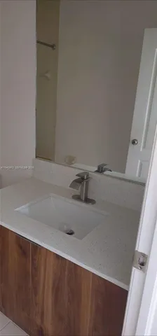 a bathroom with a toilet a sink and shower
