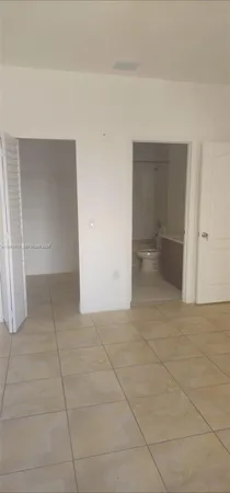 a view of a window and an empty room