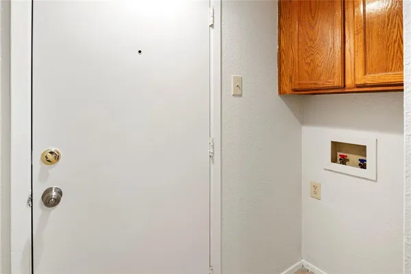 a bathroom with a granite countertop shower and a window