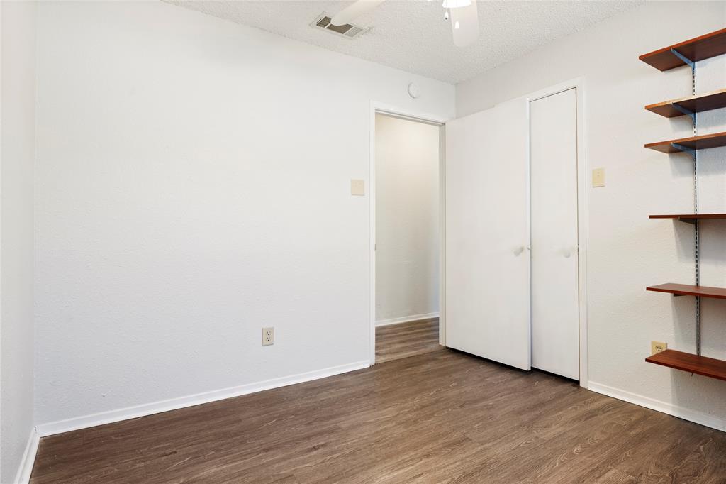 7591 Tournament Road Frisco, TX 75035 - Photo 22 of 26 a view of an empty room with wooden floor