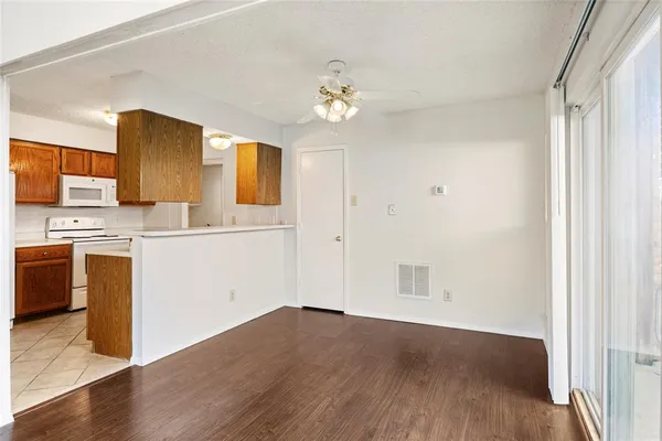 a view of a kitchen with a sink cabinet and a window