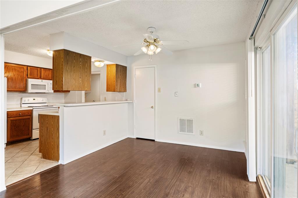 7591 Tournament Road Frisco, TX 75035 - Photo 8 of 26 a view of a kitchen with a sink cabinet and a window