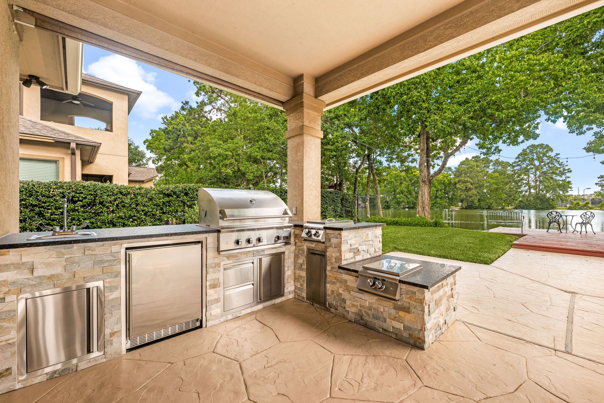 6006 Valhalla Drive Spring, TX 77379 - Photo 35 of 44 Built-in outdoor kitchen creates the ultimate space for entertaining by the pool.