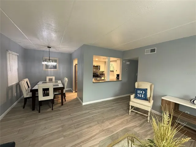 a view of a livingroom with furniture and wooden floor
