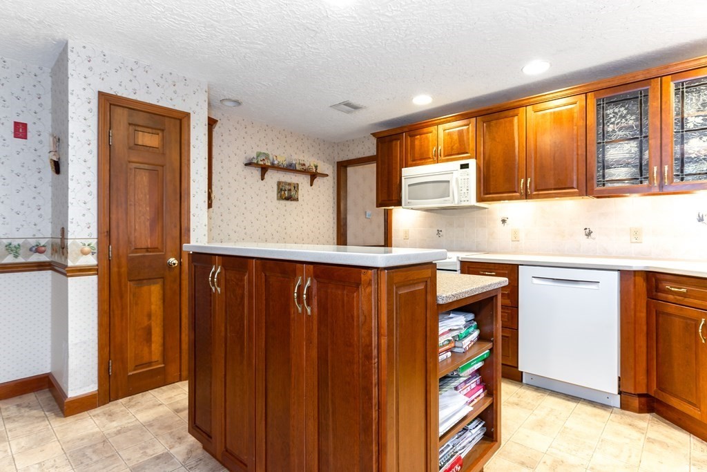 1920 Maple Street Dighton, MA 02764 - Photo 11 of 42 a kitchen with stainless steel appliances granite countertop a refrigerator and a sink