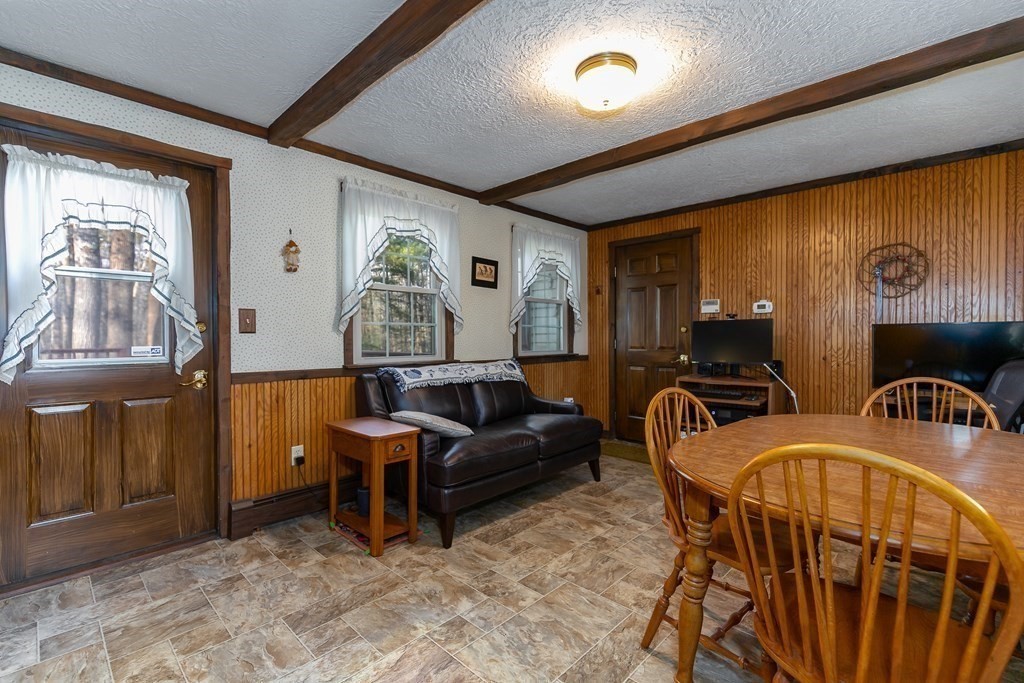 1920 Maple Street Dighton, MA 02764 - Photo 13 of 42 a living room with patio furniture and a window