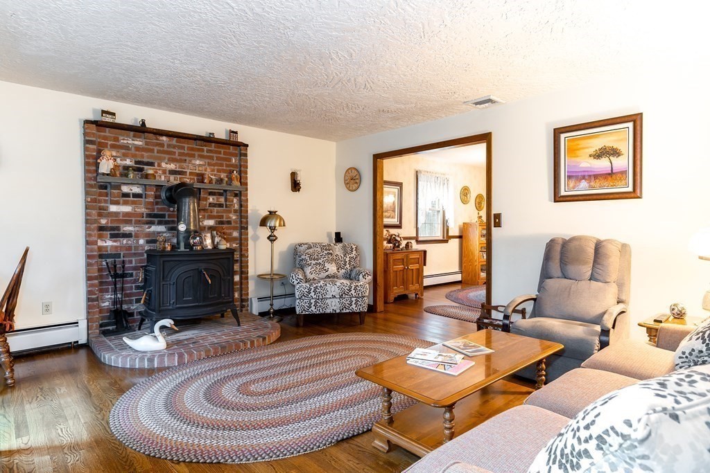 1920 Maple Street Dighton, MA 02764 - Photo 17 of 42 a room with furniture and a lamp