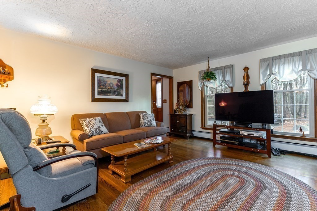 1920 Maple Street Dighton, MA 02764 - Photo 18 of 42 a living room with furniture and a flat screen tv