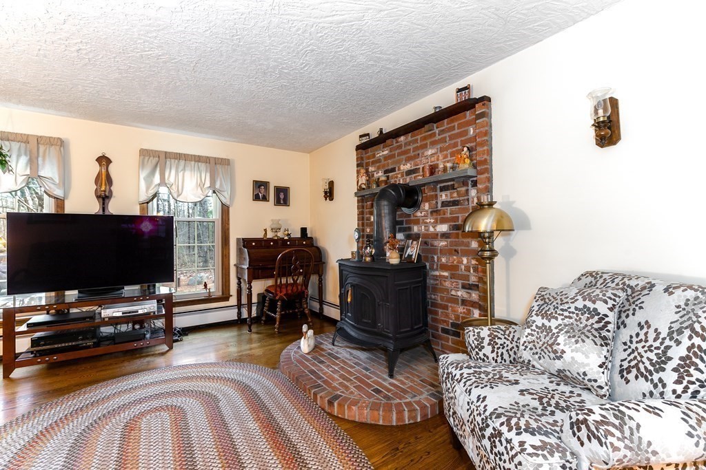 1920 Maple Street Dighton, MA 02764 - Photo 19 of 42 a living room with furniture and a flat screen tv