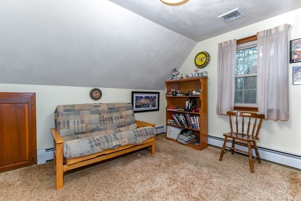 1920 Maple Street Dighton, MA 02764 - Photo 28 of 42 a bedroom with a bed and a window