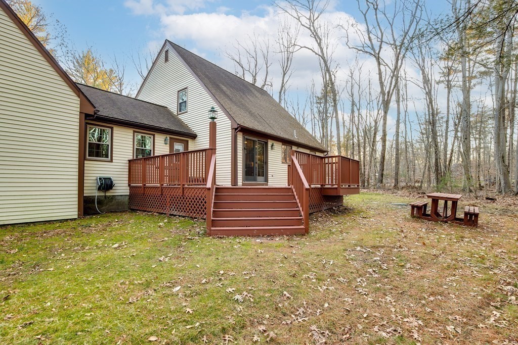 1920 Maple Street Dighton, MA 02764 - Photo 35 of 42 a view of a house with a yard and wooden fence