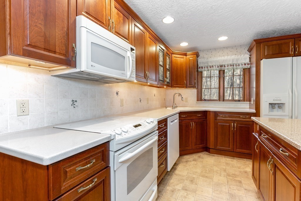 1920 Maple Street Dighton, MA 02764 - Photo 6 of 42 a kitchen with stainless steel appliances granite countertop a sink and a stove