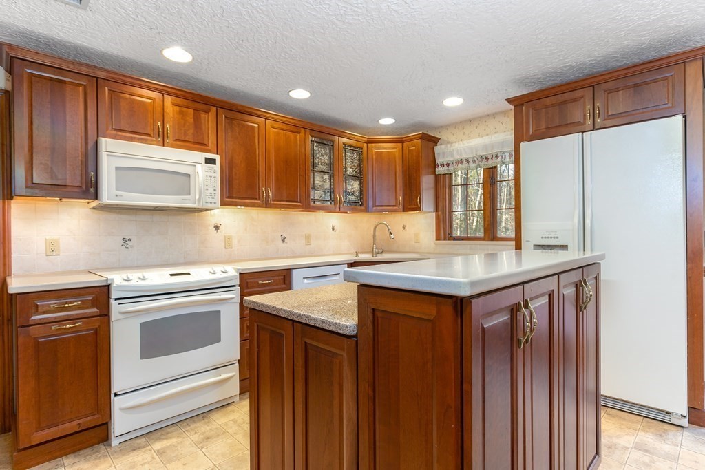 1920 Maple Street Dighton, MA 02764 - Photo 9 of 42 a kitchen with a sink stove and microwave