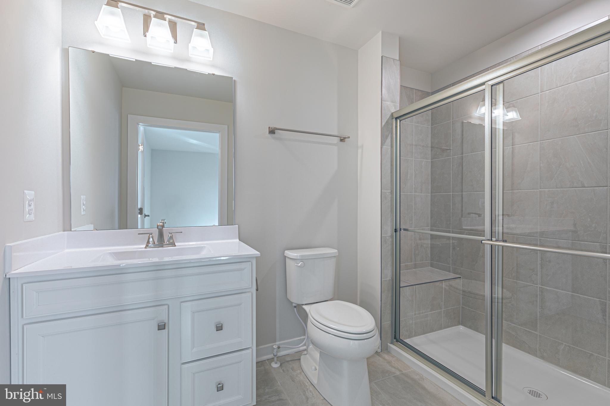 90 Tilapia Road Inwood, WV 25428 - Photo 22 of 34 Primary Bath w/ Tiled Seated Shower