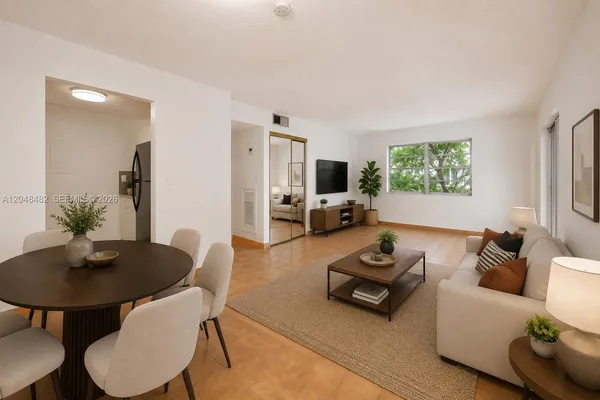 a living room with furniture and a table