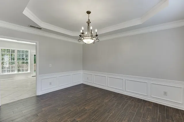 a view of an entryway with wooden floor