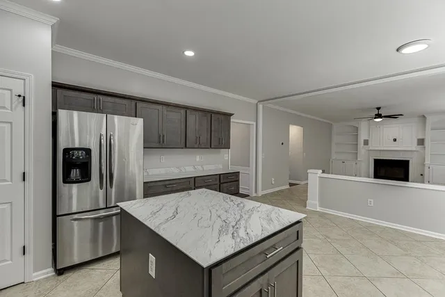 a spacious bedroom with a bed and a large window