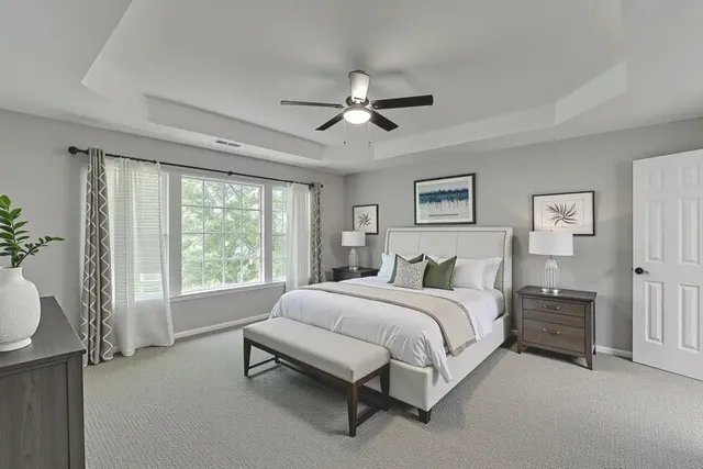 a bathroom with a double vanity sink a mirror and a bathtub