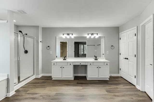 an empty room with a ceiling fan and a window