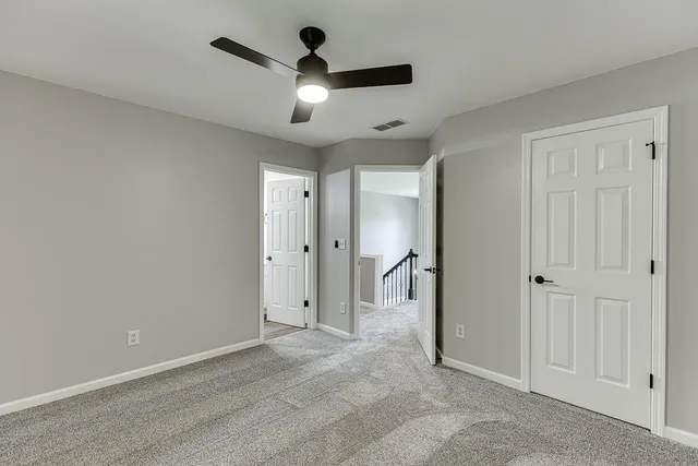 an aerial view of a house with pool garden and a yard