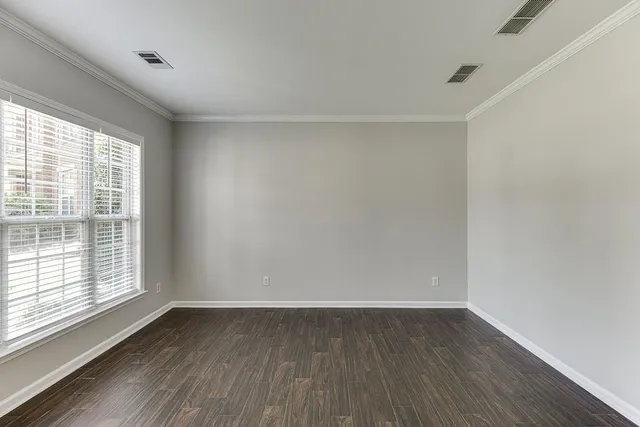a living room with furniture a rug and a large window