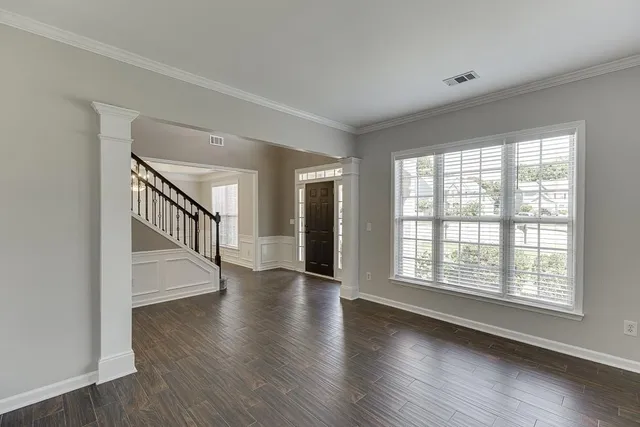 a view of an entryway with wooden floor