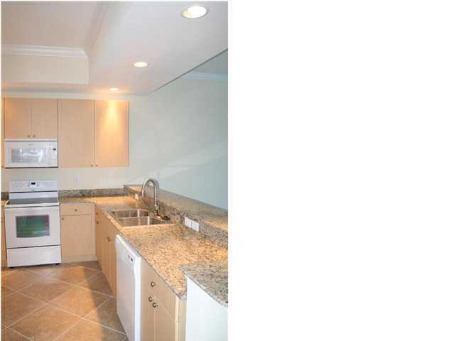 211 Durango Road, Unit 415 Destin, FL 32541 - Photo 2 of 12 a kitchen with a stove and a sink
