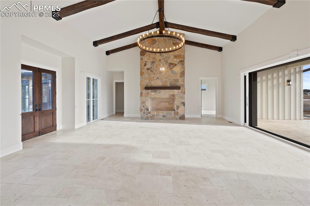 16864 Horizon Ridge Trail Colorado Springs, CO 80908 - Photo 12 of 47 a view of a hallway with a chandelier fan and windows