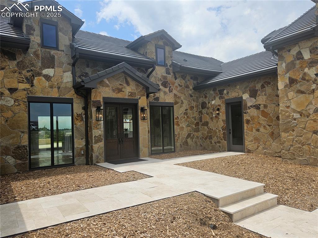 16864 Horizon Ridge Trail Colorado Springs, CO 80908 - Photo 3 of 47 a view of a building with door
