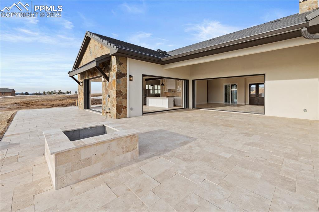 16864 Horizon Ridge Trail Colorado Springs, CO 80908 - Photo 10 of 47 a view of a house with backyard and ocean view