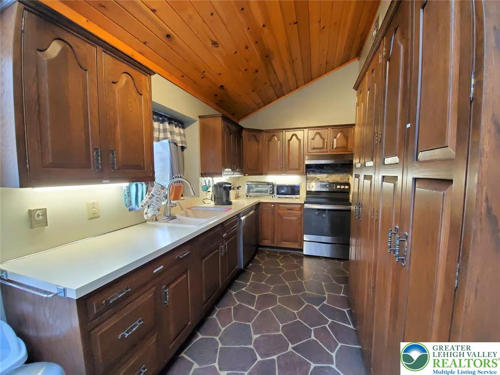 1271 Kilmer Road Tobyhanna, PA 18466 - Photo 12 of 45 a kitchen with a sink stove and cabinets