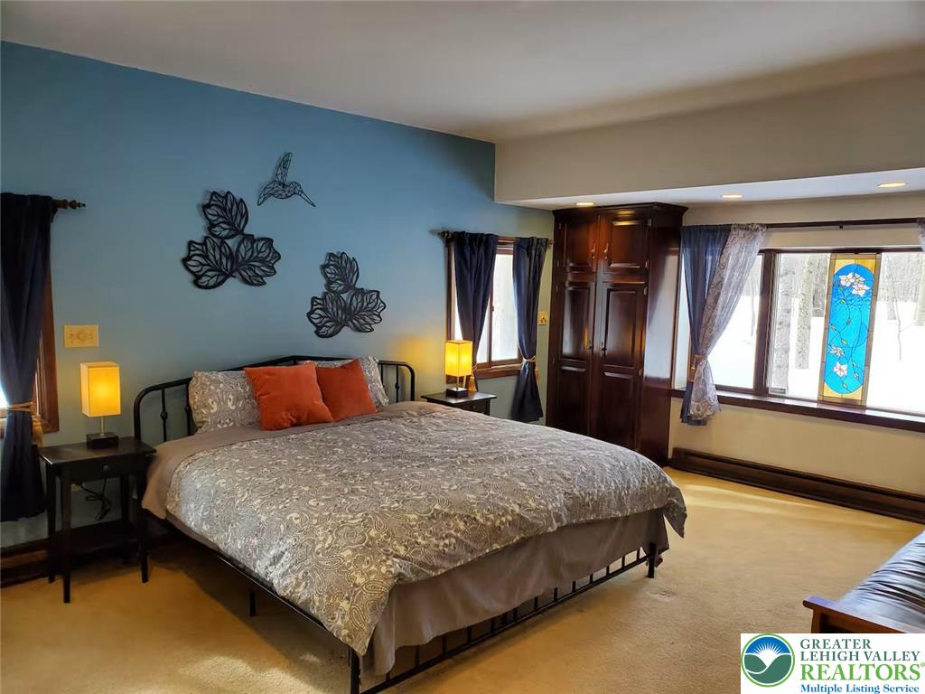 1271 Kilmer Road Tobyhanna, PA 18466 - Photo 15 of 45 a bedroom with a bed and dresser with mirror