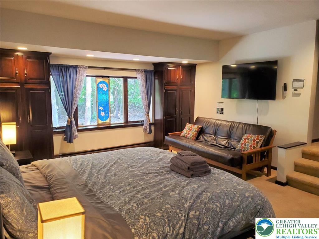 1271 Kilmer Road Tobyhanna, PA 18466 - Photo 16 of 45 a living room with furniture and a flat screen tv