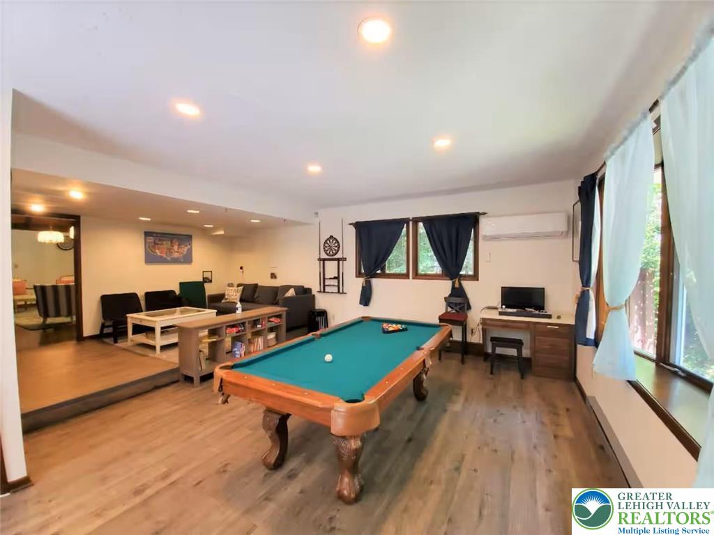 1271 Kilmer Road Tobyhanna, PA 18466 - Photo 28 of 45 a living room with furniture a pool table and a large window