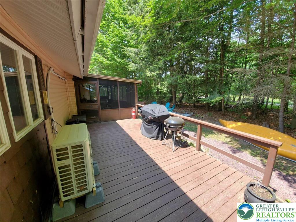 1271 Kilmer Road Tobyhanna, PA 18466 - Photo 34 of 45 a balcony with wooden floor table and chairs