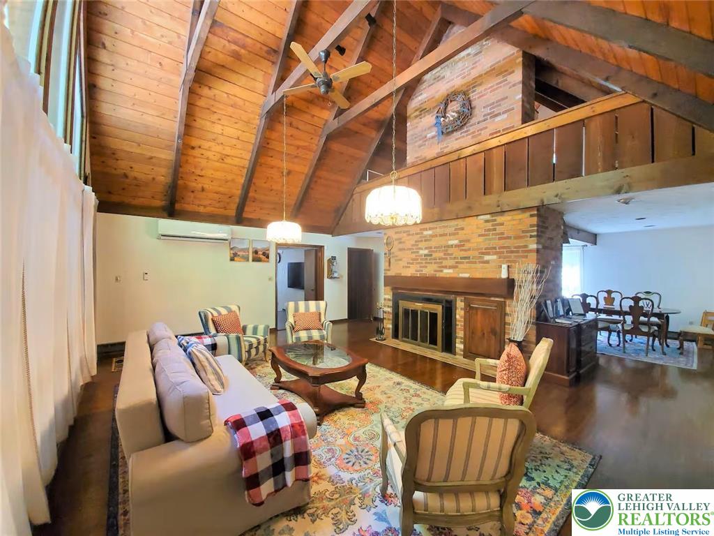 1271 Kilmer Road Tobyhanna, PA 18466 - Photo 4 of 45 a living room with furniture a fireplace and a table