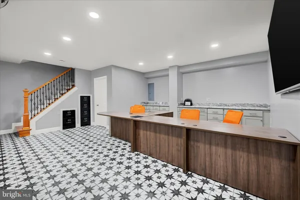 a kitchen with stainless steel appliances kitchen island granite countertop a sink and cabinets