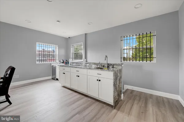 a kitchen with sink and window
