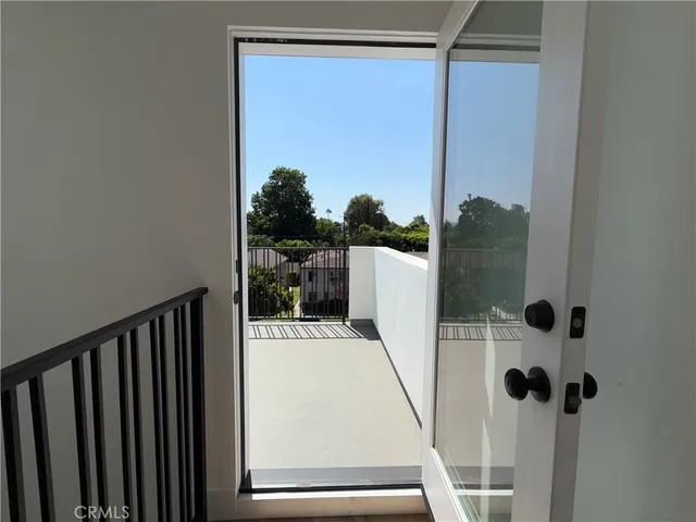 a view of bathroom with a tub and mirror
