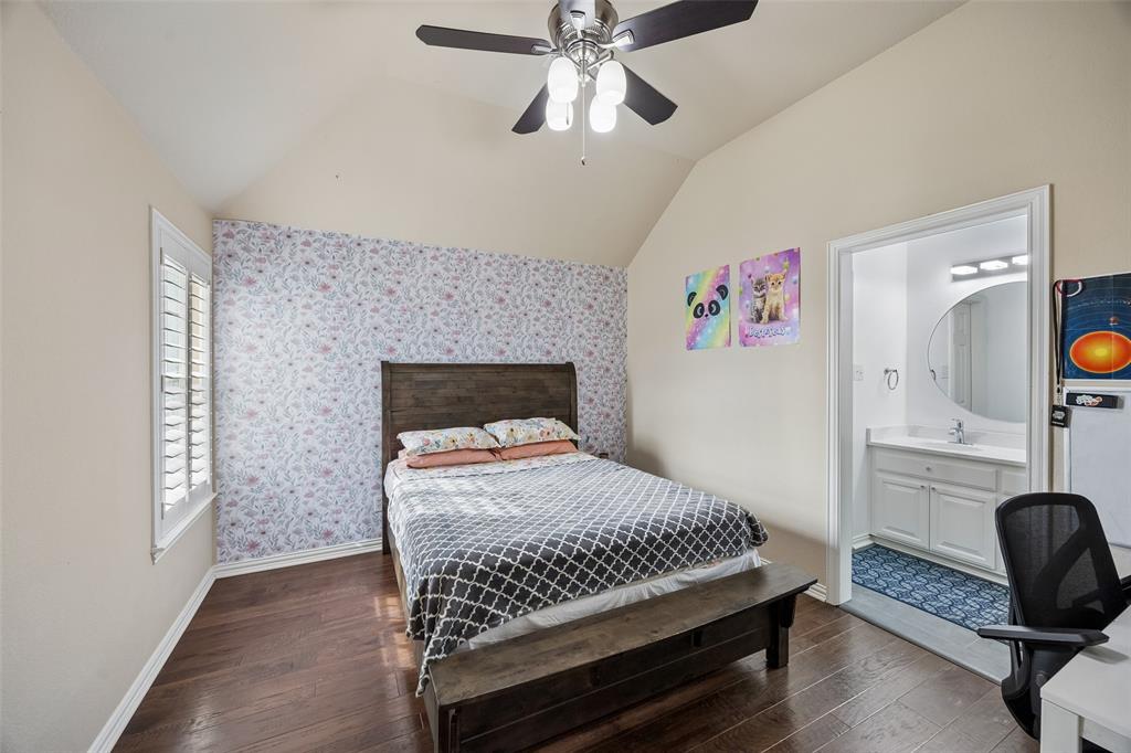 2865 Ridge View Road Frisco, TX 75034 - Photo 28 of 38 Vaulted ceiling with a ceiling fan, wood-finish flooring, and white window shutters