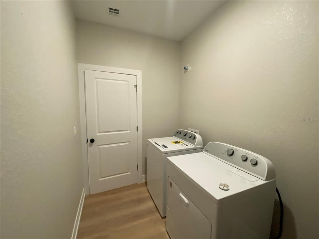 10524 Pendleton Avenue Englewood, FL 34224 - Photo 10 of 12 a utility room with dryer and washer