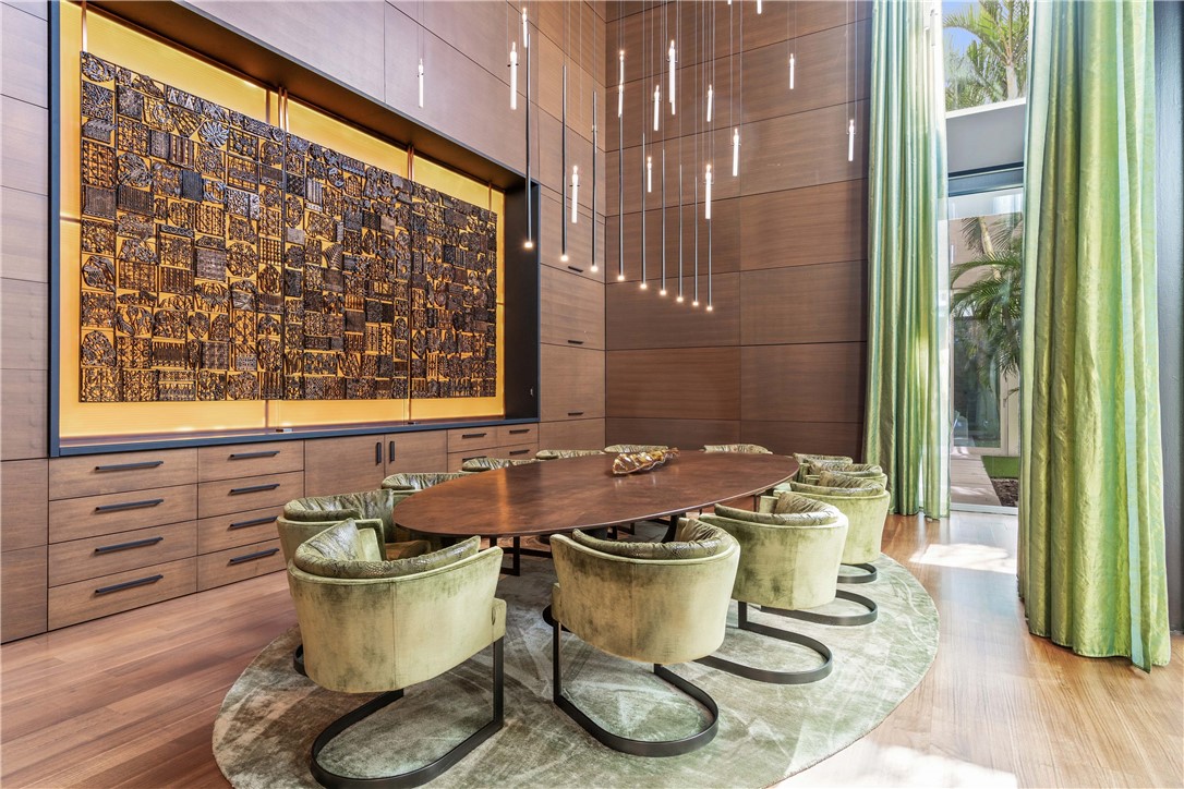 3700 Ocean Drive Vero Beach, FL 32963 - Photo 12 of 36 a dining room with furniture and wooden floor