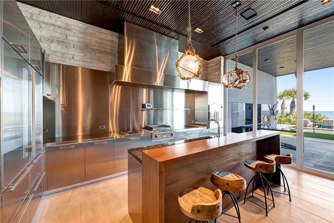 3700 Ocean Drive Vero Beach, FL 32963 - Photo 15 of 36 a view of a chairs and table in a patio