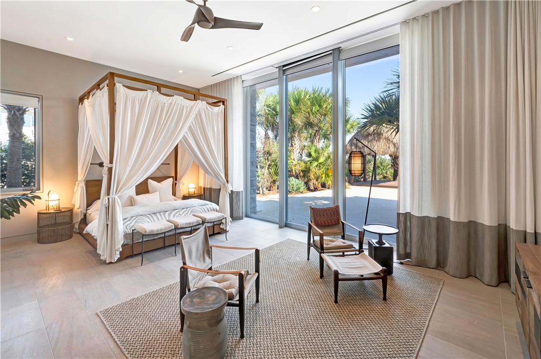 3700 Ocean Drive Vero Beach, FL 32963 - Photo 19 of 36 a living room with furniture and a large window