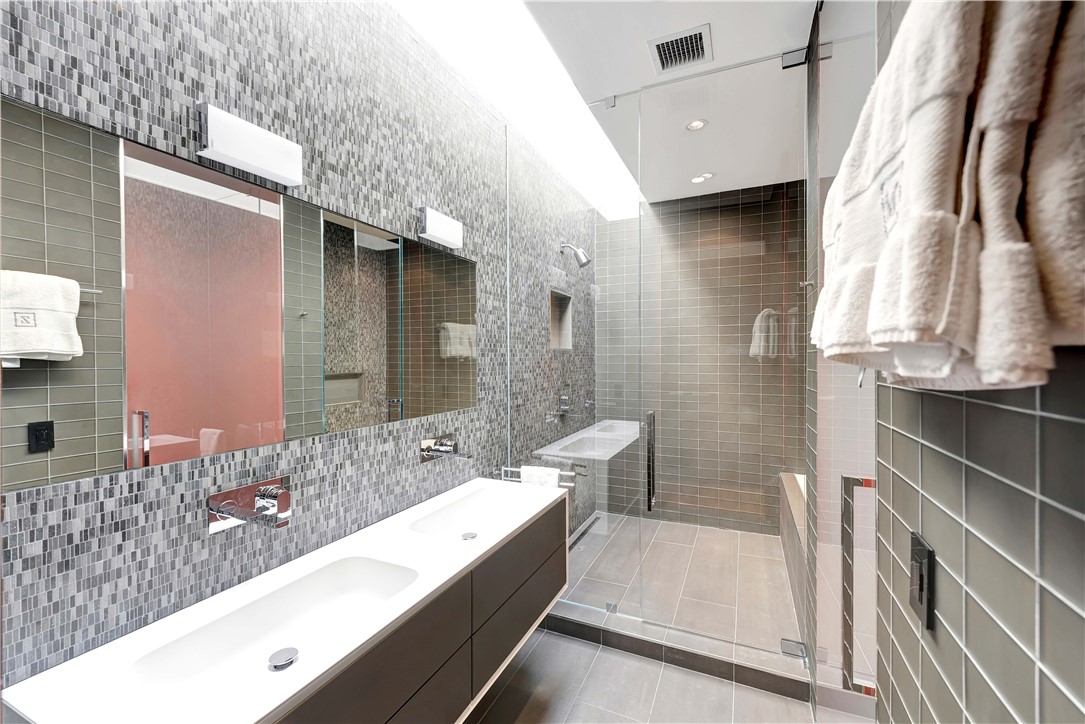 3700 Ocean Drive Vero Beach, FL 32963 - Photo 27 of 36 a bathroom with a bathtub and a sink