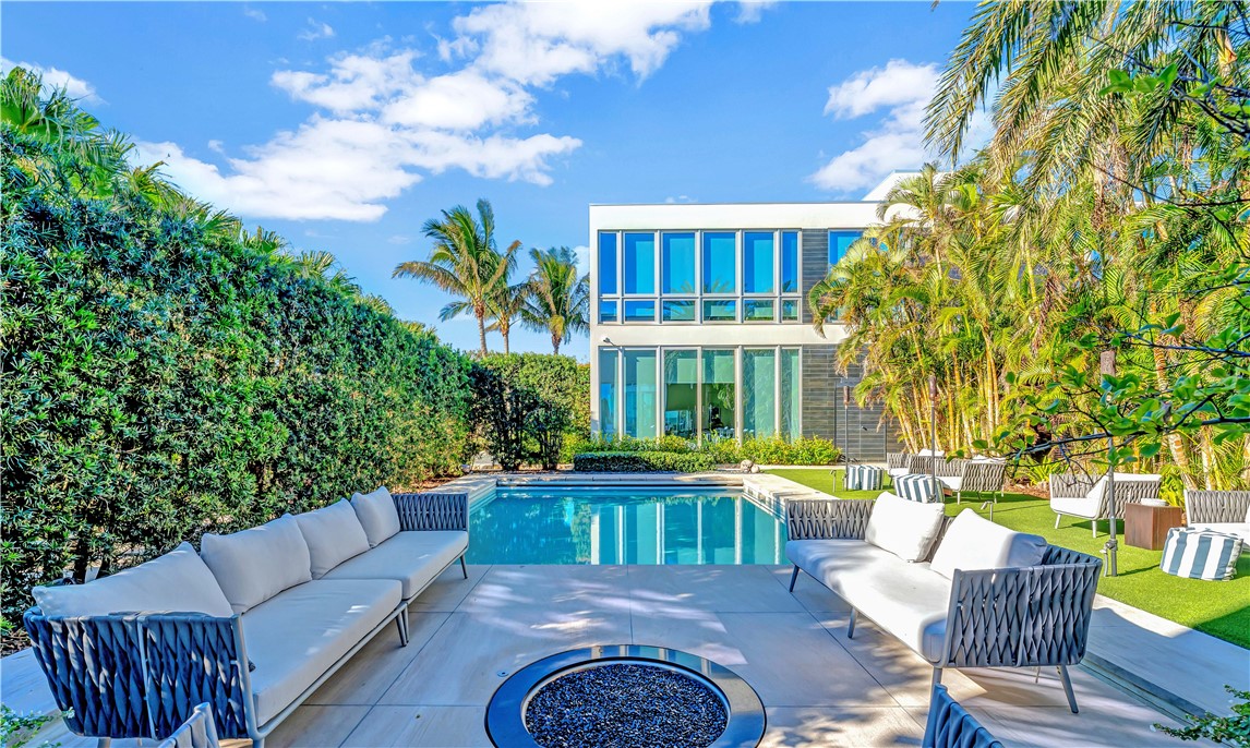 3700 Ocean Drive Vero Beach, FL 32963 - Photo 30 of 36 a view of a patio with couches table and chairs and potted plants