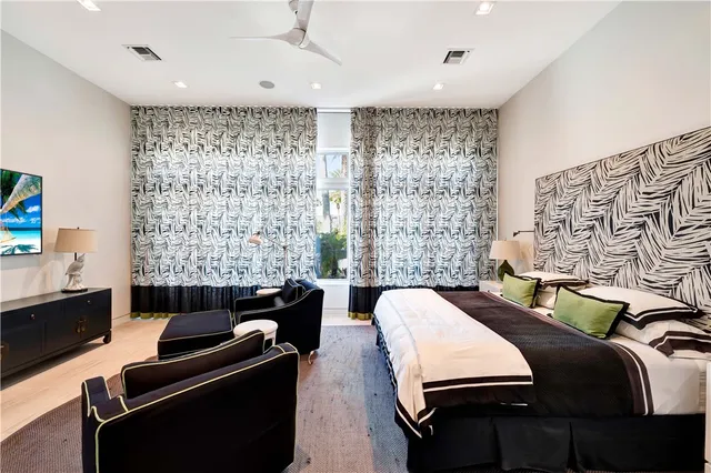 a bedroom with a bed and a couch