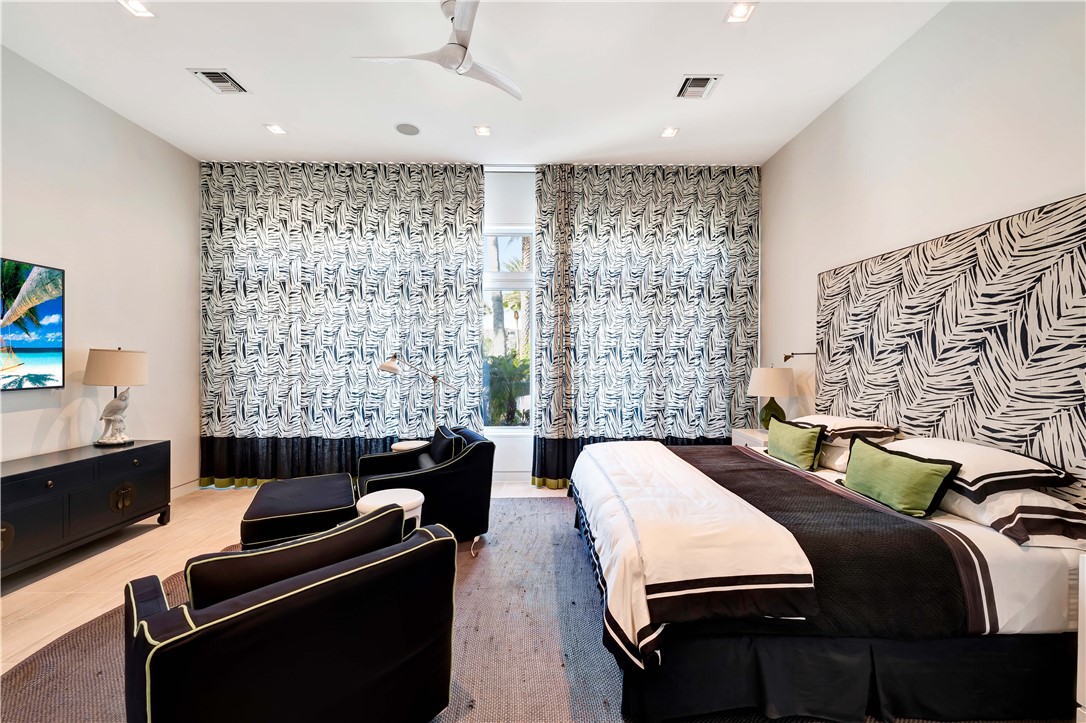 3700 Ocean Drive Vero Beach, FL 32963 - Photo 33 of 36 a bedroom with a bed and a couch