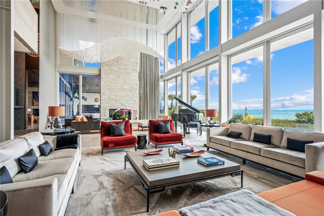 3700 Ocean Drive Vero Beach, FL 32963 - Photo 6 of 36 a living room with furniture and a large window